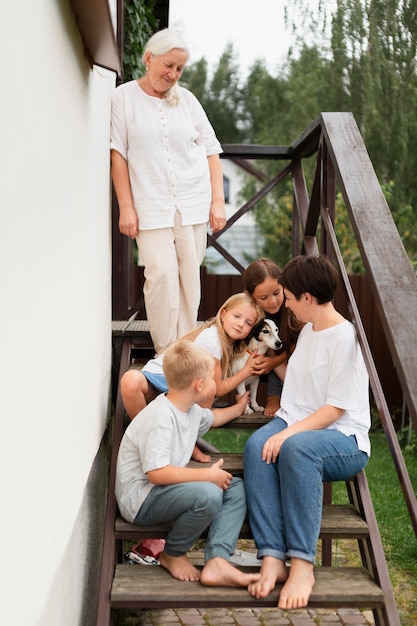 Full shot happy family with dog