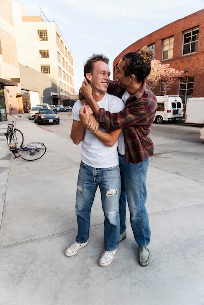 Full shot happy men hugging