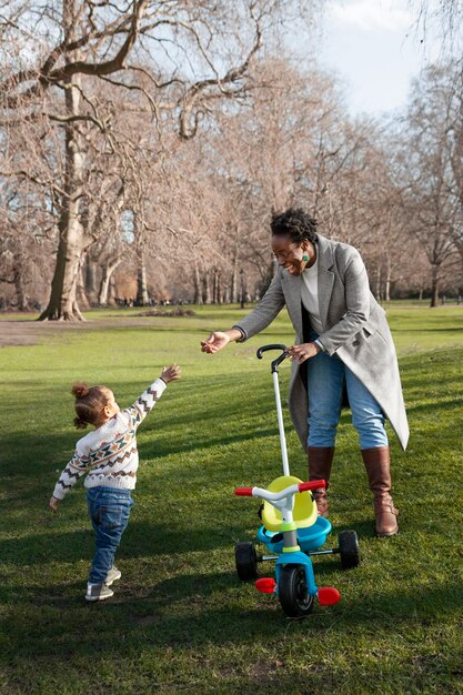 Full shot happy woman and child in nature