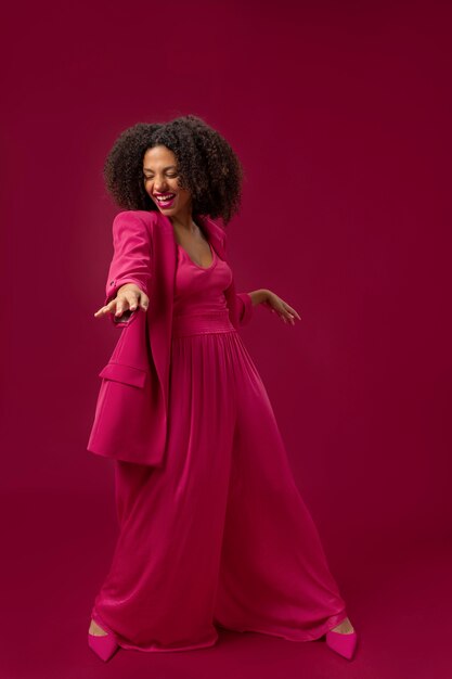 Full shot happy woman with pink outfit