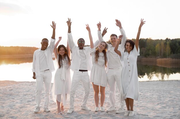 Full shot happy young people at white party