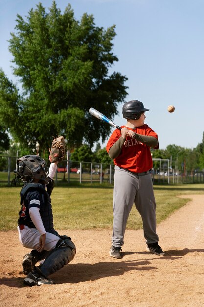 Full shot kid holding baseball bat