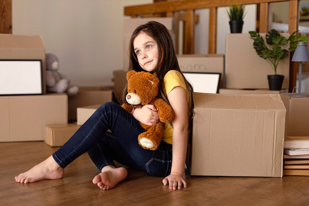 Full shot kid holding toy