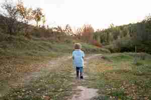 Free photo full shot kid in nature