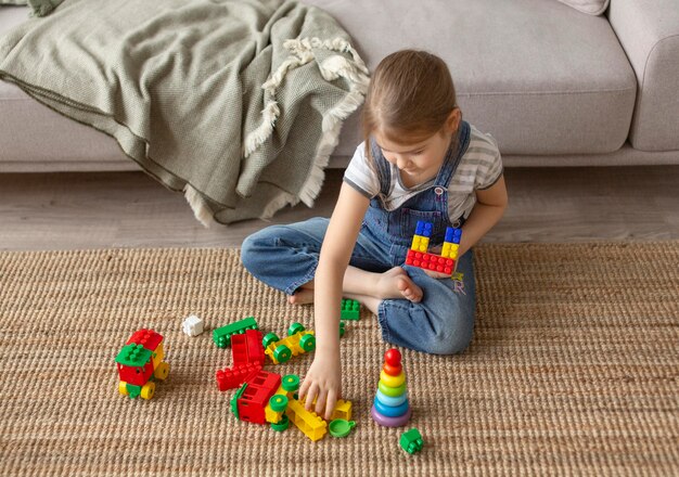 Full shot kid playing at home