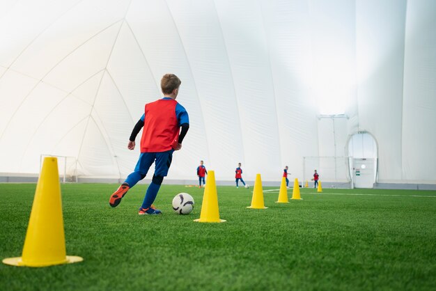 Full shot kid running on field