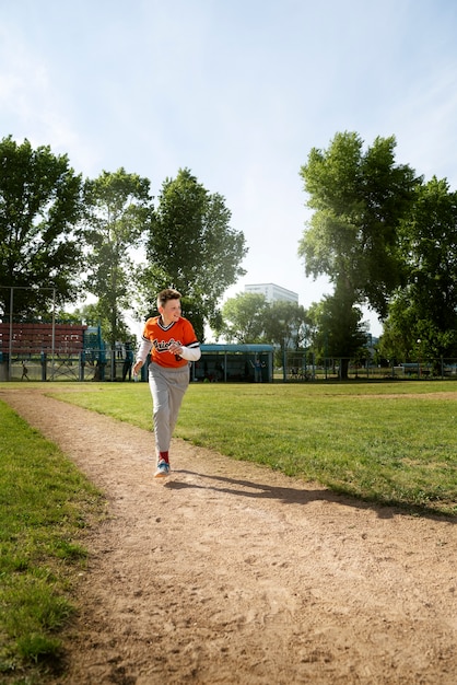 Free photo full shot kid running on field