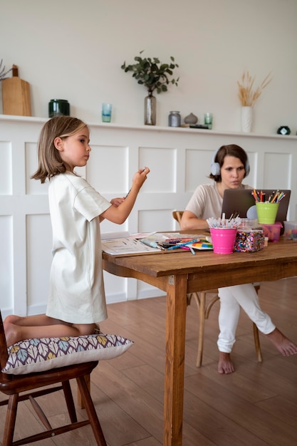 Full shot kid sitting on chair