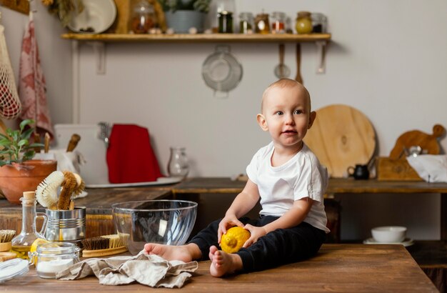 Full shot kid sitting on table