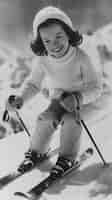 Free photo full shot kid skiing monochrome