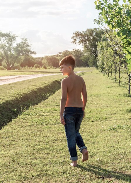 Full shot kid walking outdoors