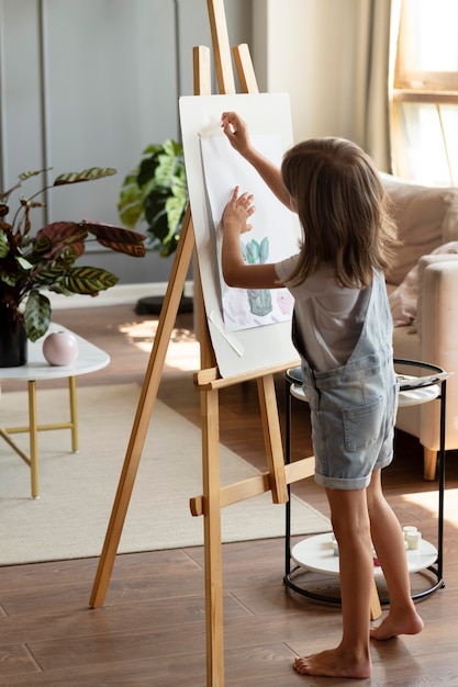 full shot kid with painting