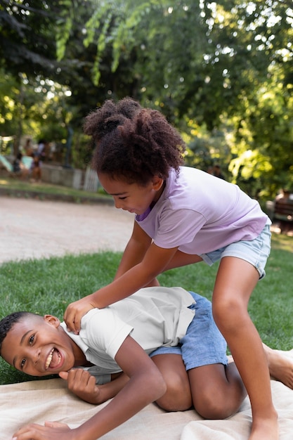 Full shot kids playing outdoors