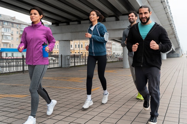 Full shot latin people training outdoors