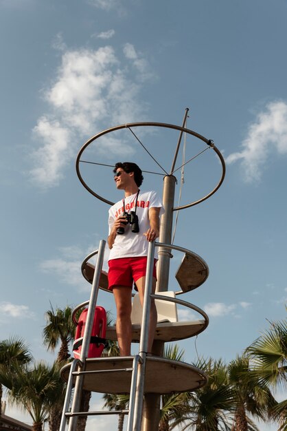 Full shot lifeguard with binoculars