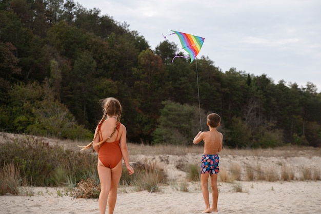 Full shot little kids having fun at the beach