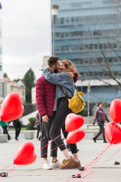 Full shot of lovely couple kissing