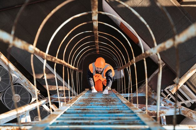 Full shot man climbing ladder