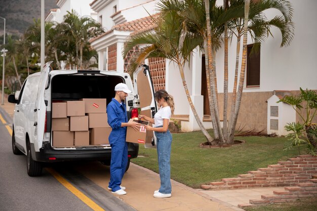 Full shot man delivering box