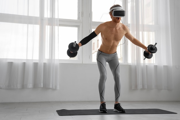 Foto gratuita uomo a figura intera che fa fitness con gli occhiali vr