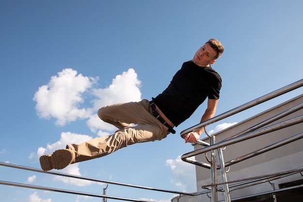 Full shot man doing  parkour training