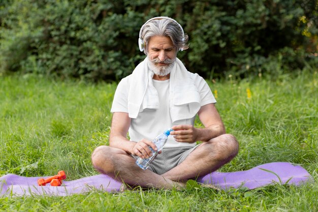 Full shot man doing sport outdoors