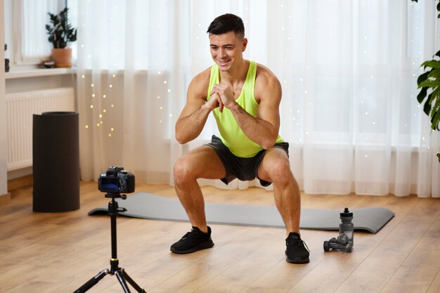 Full shot man doing squat