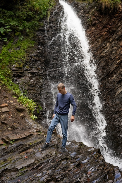 Full shot man enjoying time in nature