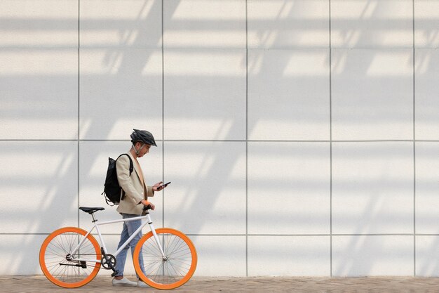 Full shot man going with bicycle