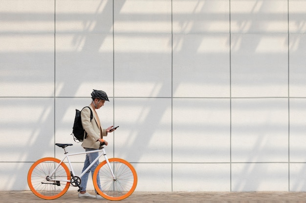 Full shot man going with bicycle