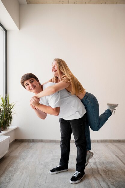 Full shot man holding woman