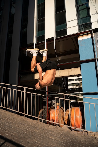 Full shot man jumping outdoors