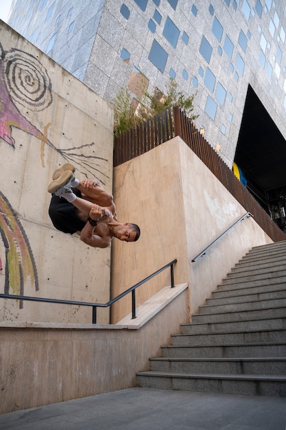 Full shot man jumping outdoors