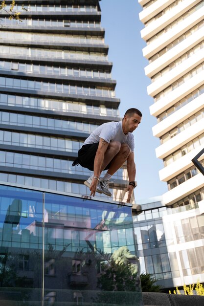 Full shot man jumping outdoors