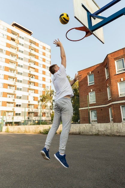 Full shot man playing basketball