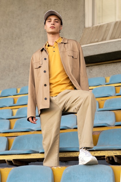 Full shot man posing in grandstands