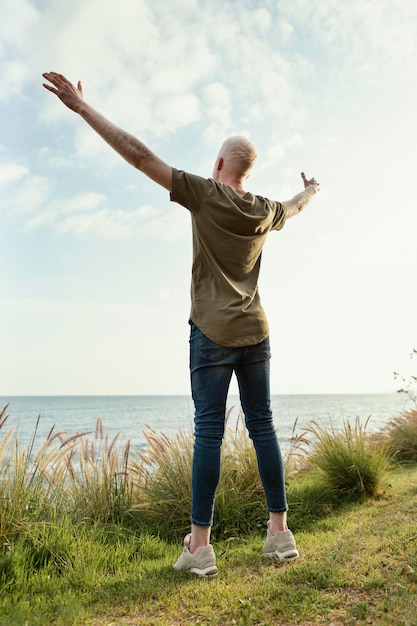 Full shot man posing outdoors