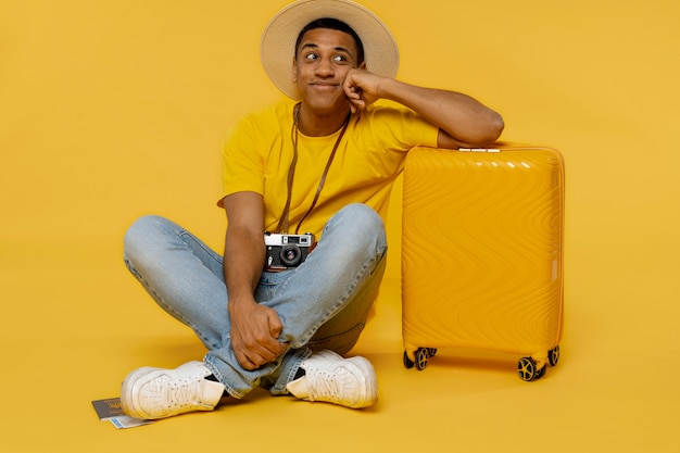 Full shot man posing with baggage