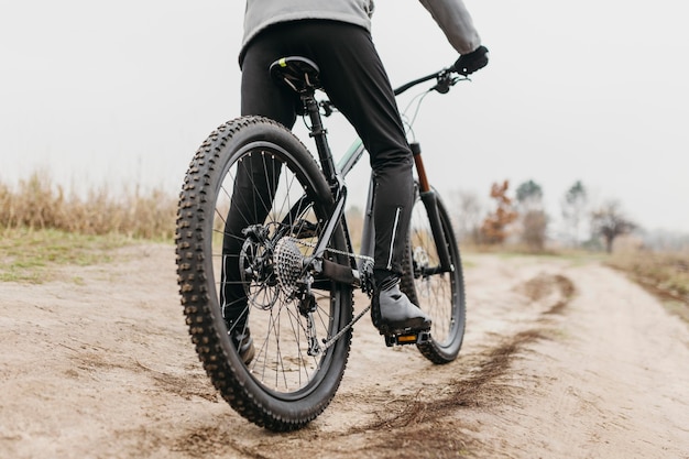 Full shot of man riding a bike