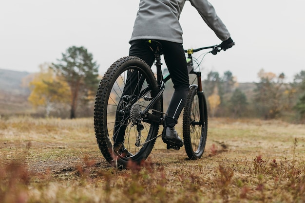 Full shot of man riding a bike