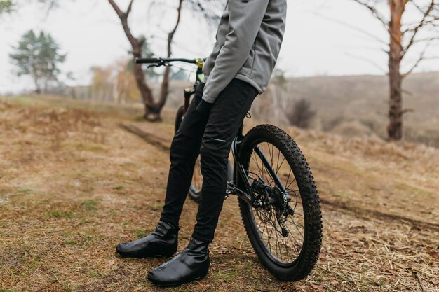 Full shot of man riding a bike