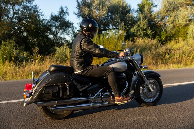 Full shot man riding a motorbike