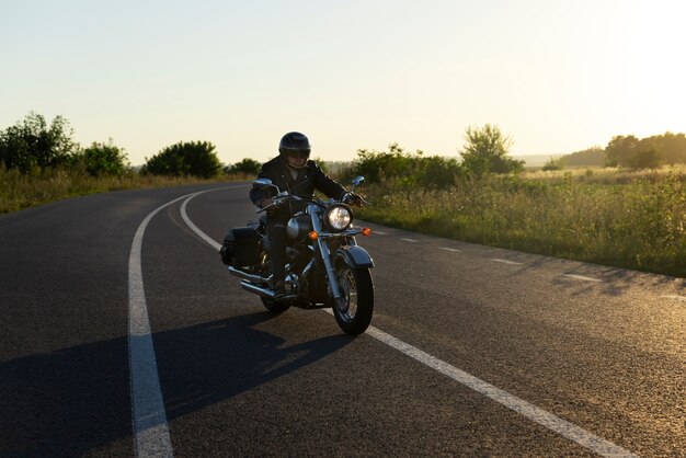 Full shot man riding a motorbike