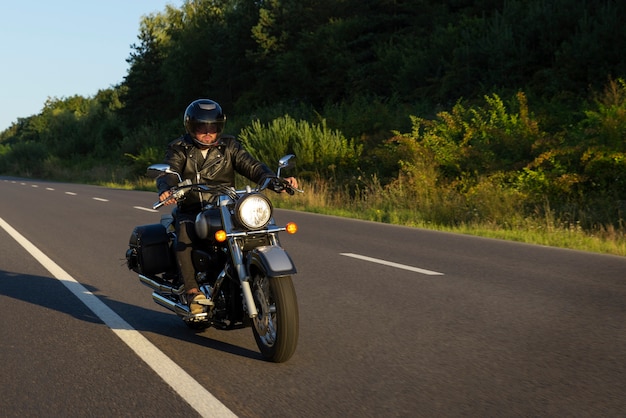 Full shot man riding a motorbike