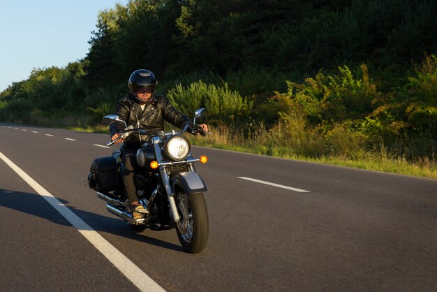 Full shot man riding a motorbike