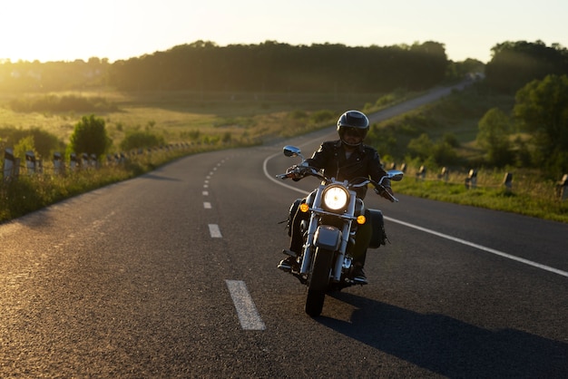 Full shot man riding a motorbike