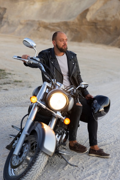 Free photo full shot man riding a motorbike