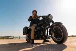 Free photo full shot man riding a motorbike