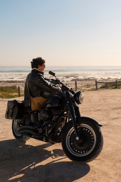 Full shot man riding a motorbike