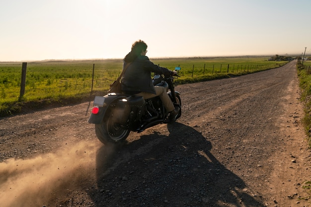 Full shot man riding a motorbike